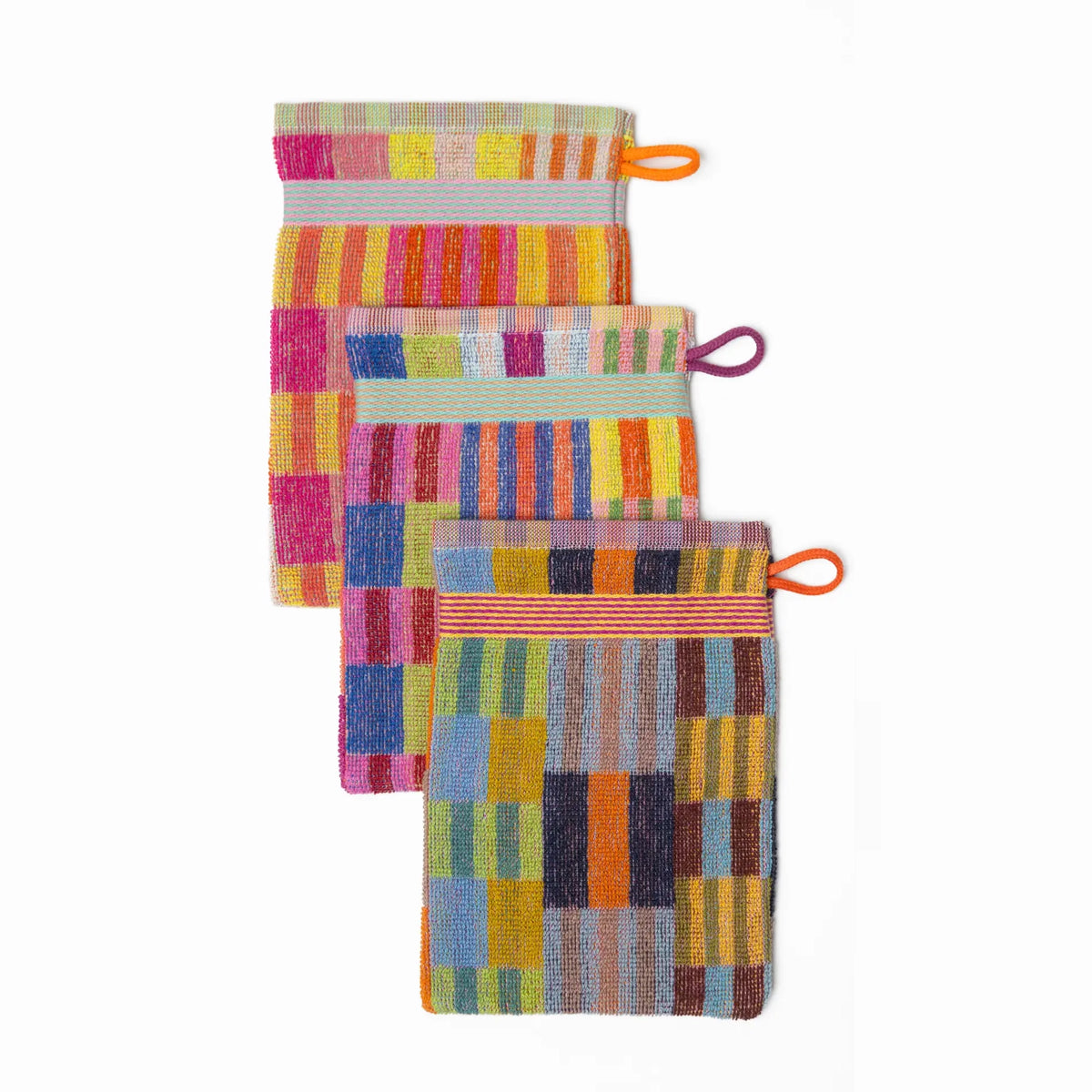 3 pack wash cloths by Foekje Fleur. Colorful cotton textile made from leftover yarns, featuring unique woven color combinations and a hanging label, photographed folded on a neutral background.