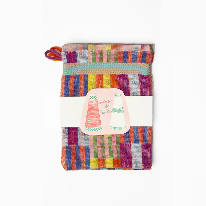 3 pack wash cloths by Foekje Fleur. Colorful cotton textile made from leftover yarns, featuring unique woven color combinations and a hanging label, photographed folded on a neutral background.