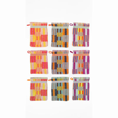 3 pack wash cloths by Foekje Fleur. Colorful cotton textile made from leftover yarns, featuring unique woven color combinations and a hanging label, photographed folded on a neutral background.