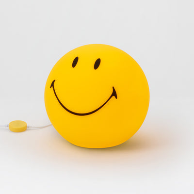 Smiley Star Light, a 25cm dimmable LED table lamp by Mr Maria, designed for a warm and cheerful atmosphere.