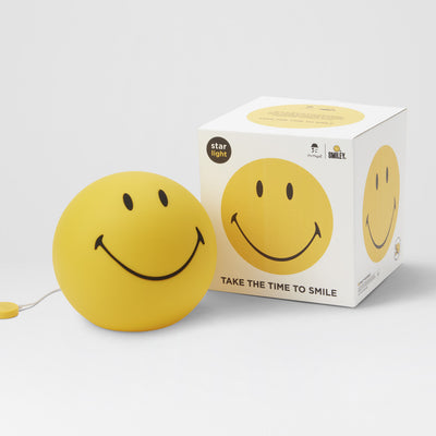 Smiley Star Light, a 25cm dimmable LED table lamp by Mr Maria, designed for a warm and cheerful atmosphere.