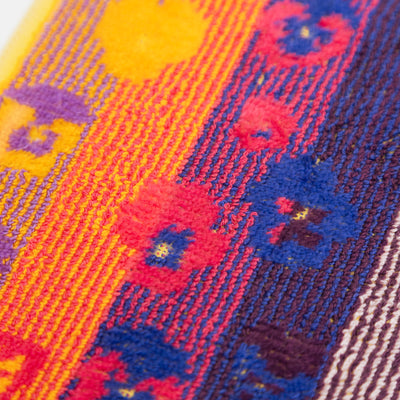 Set of two sustainable colorful guest towels with pansy pattern made from leftover cotton yarns with velour finish – made in Portugal