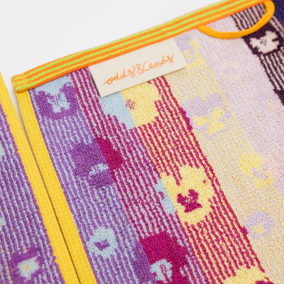 Set of two sustainable colorful guest towels with pansy pattern made from leftover cotton yarns with velour finish – made in Portugal