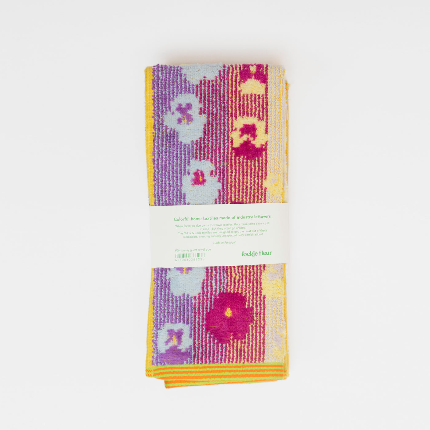 Set of two sustainable colorful guest towels with pansy pattern made from leftover cotton yarns with velour finish – made in Portugal