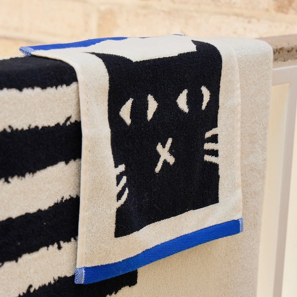 Donna Wilson Lazy Cat Face Cloth – super soft 100% cotton jacquard face cloth featuring a playful lazy cat design, made in Portugal
