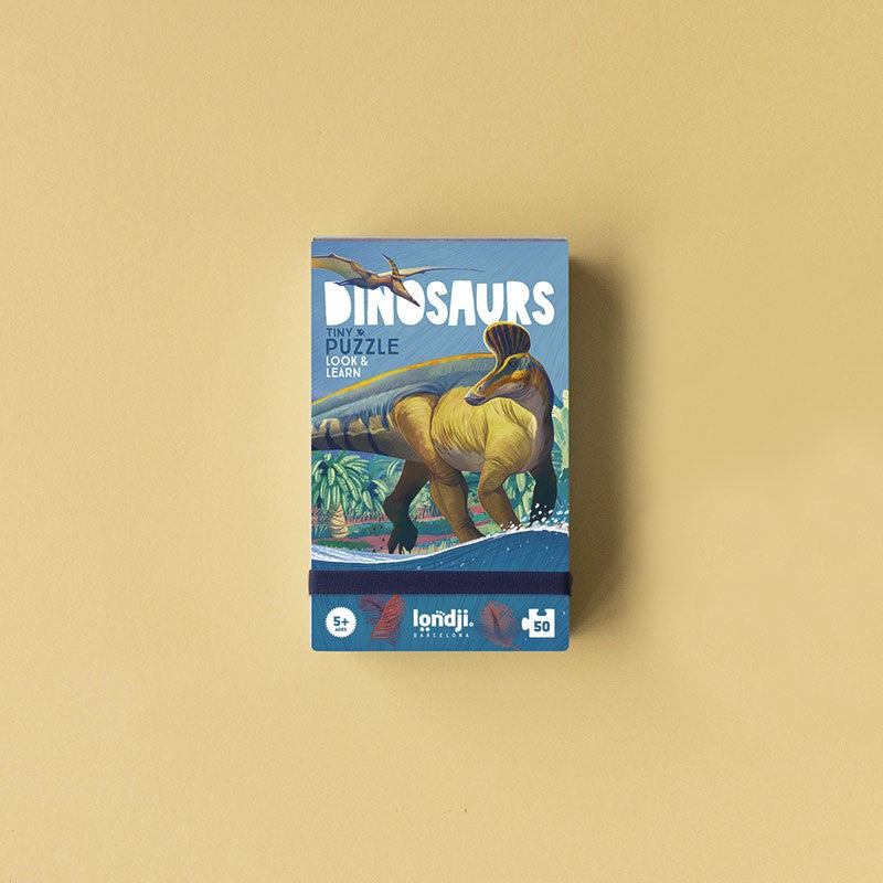 Londji Dinosaurs Tiny Puzzle – 50-piece eco-friendly educational jigsaw for kids featuring dinosaurs, made in Barcelona from recycled materials, illustrated by Román García Mora.