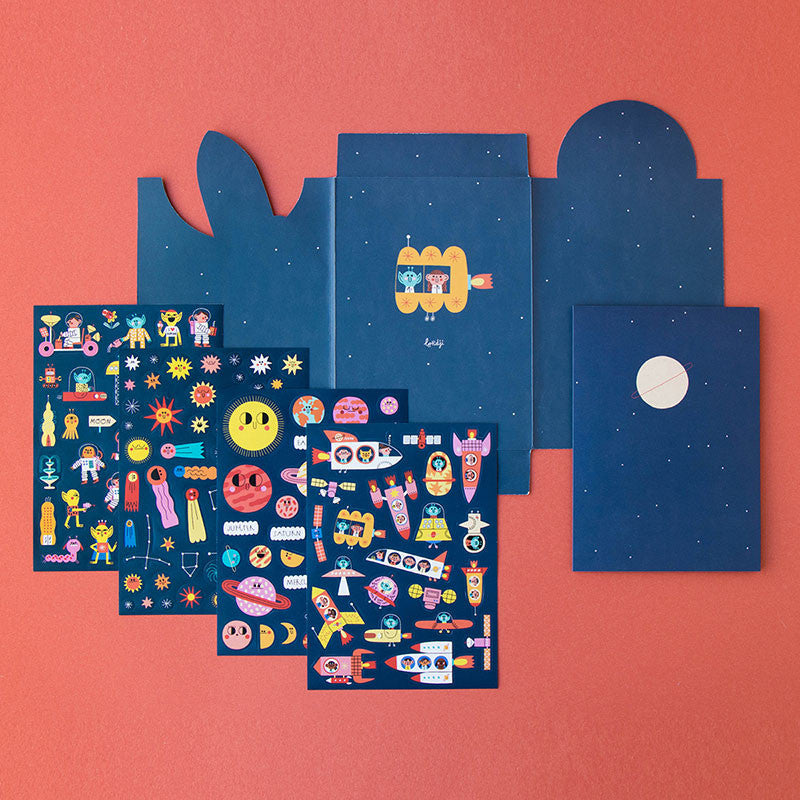 Londji Space Stickers Set 6 – reusable sticker set with 150 space-themed stickers featuring rockets, planets and stars, made in Barcelona, illustrated by Teresa Bellón.