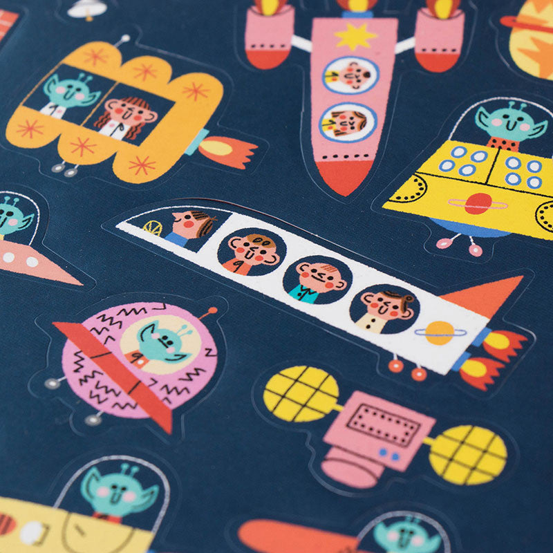 Londji Space Stickers Set 6 – reusable sticker set with 150 space-themed stickers featuring rockets, planets and stars, made in Barcelona, illustrated by Teresa Bellón.