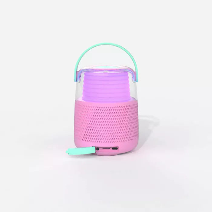 KS-80 Bluetooth Speaker in pink, featuring powerful sound, light effects, and a wireless microphone with fun voice effects, perfect for parties and karaoke.