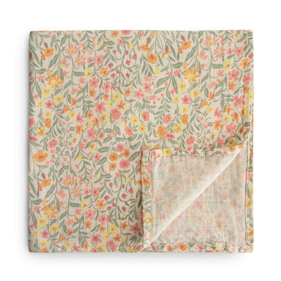 Cozy and soft organic cotton baby swaddle by Mushie with pastel blooms print, ideal for swaddling, nursing, and cuddling. Made from 100% organic muslin cotton, gentle on baby’s skin, 120x120cm