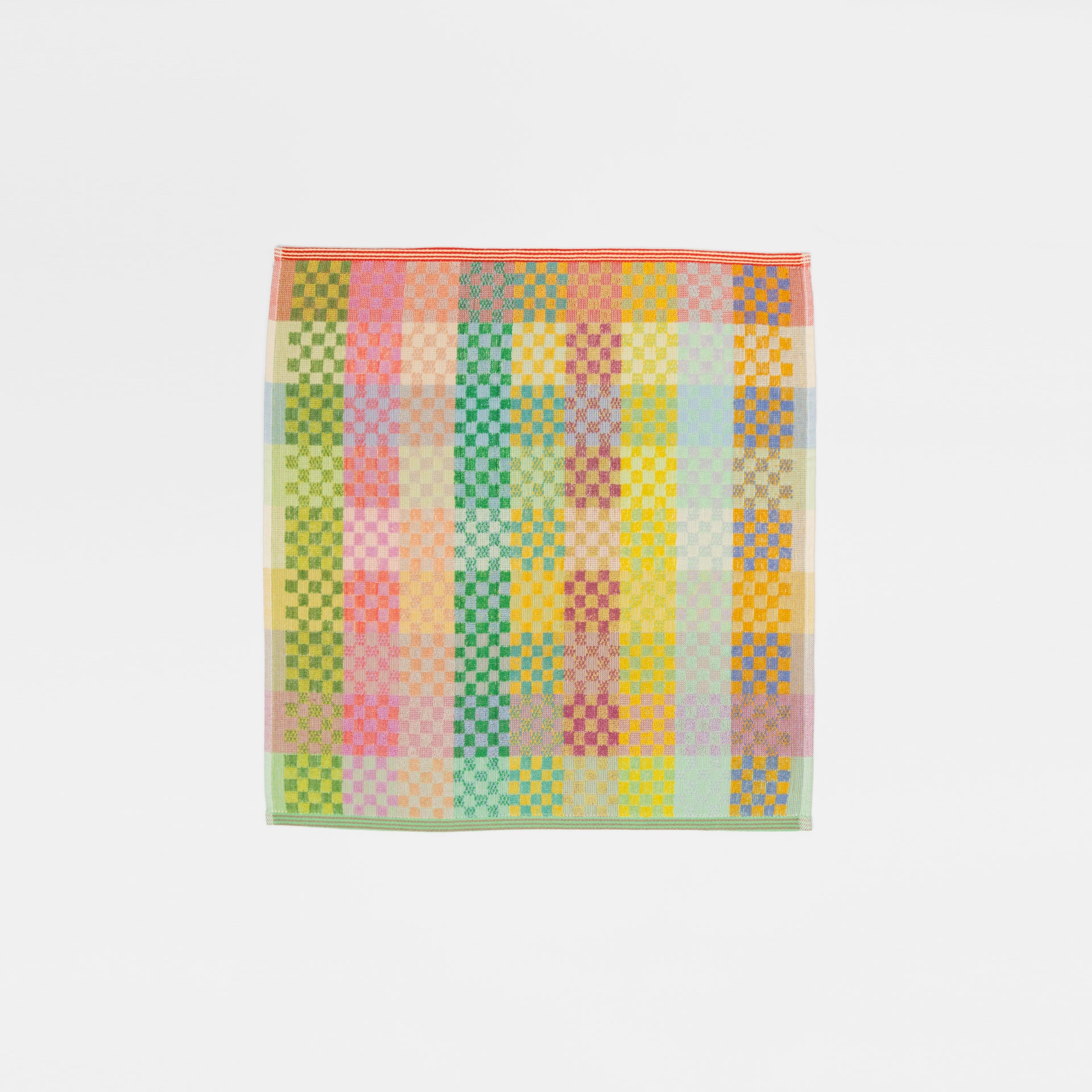 Sustainable kitchen towel in a bold checkered pattern no 56, made from deadstock cotton yarns. Features a 50/50 terry and flat weave design, 50 x 50 cm size, and hanging label. Crafted in Portugal by Foekje Fleur.