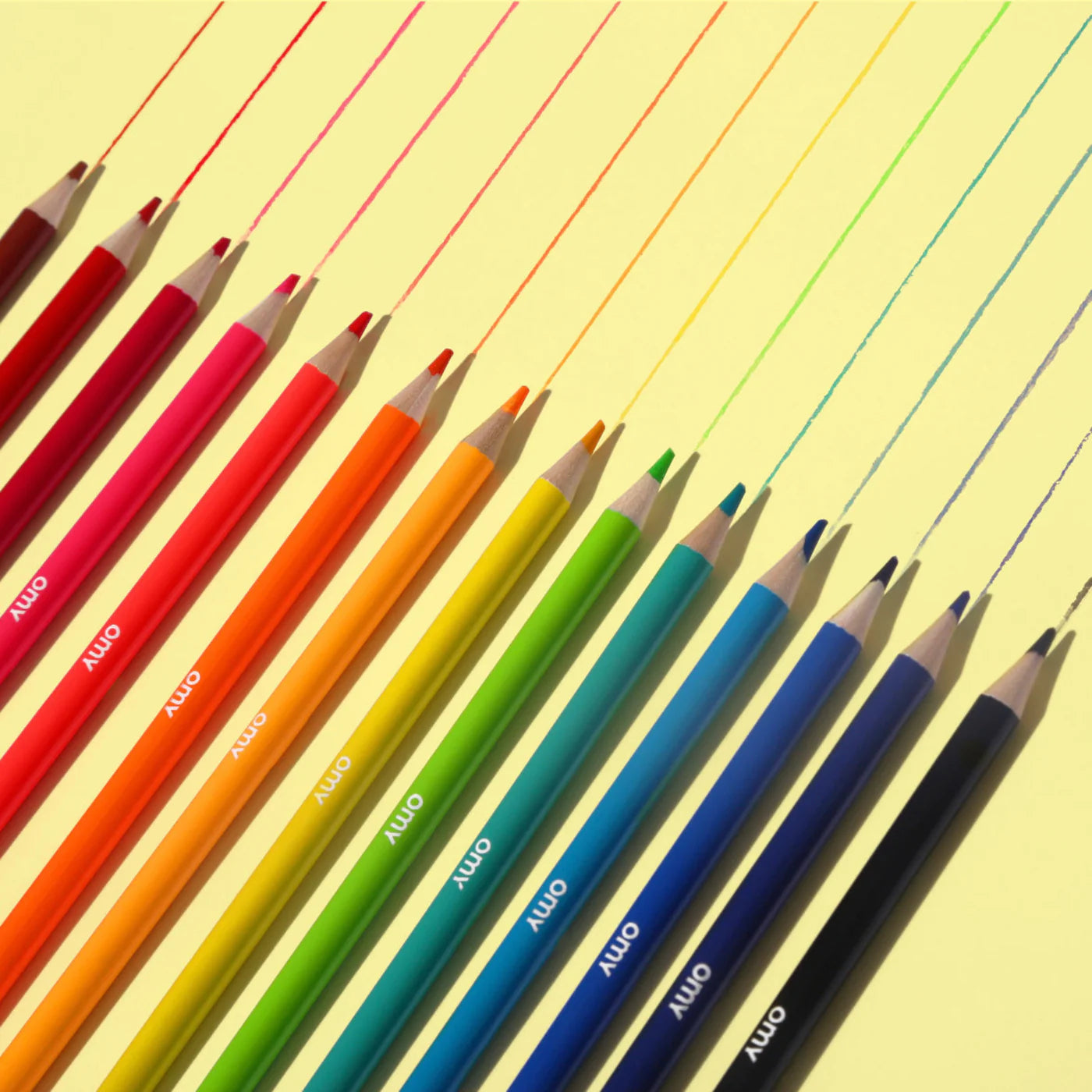Box of 16 OMY colored pencils in neon and shiny colors, made of round wooden barrels with box that doubles as a pencil holder