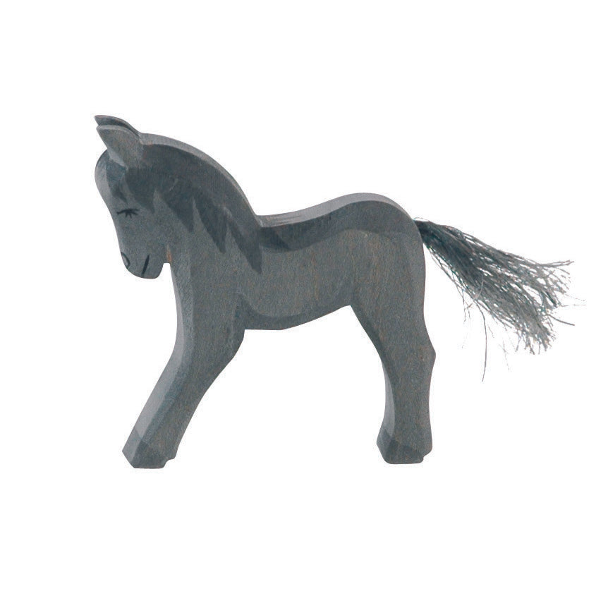 Handcrafted Ostheimer wooden black foal figure, made from natural wood with non-toxic finish, ideal for imaginative play and animal collections