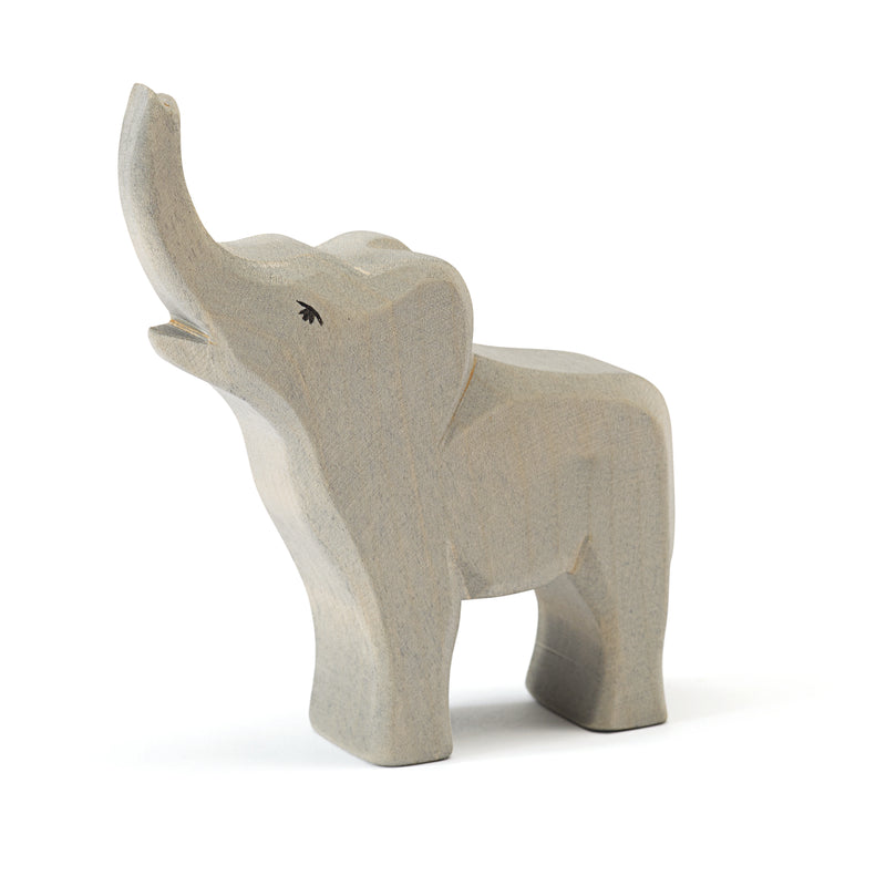Handcrafted Ostheimer wooden baby elephant trumpeting figure, made from natural wood with a non-toxic finish, perfect for open-ended play and sensory exploration