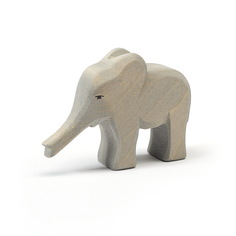Ostheimer handcrafted wooden baby elephant figure for imaginative play and sensory development.