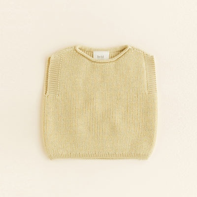 HVID seamless knitted baby vest in extra fine Italian merino wool with a unique stretch collar design for easy dressing in light yellow