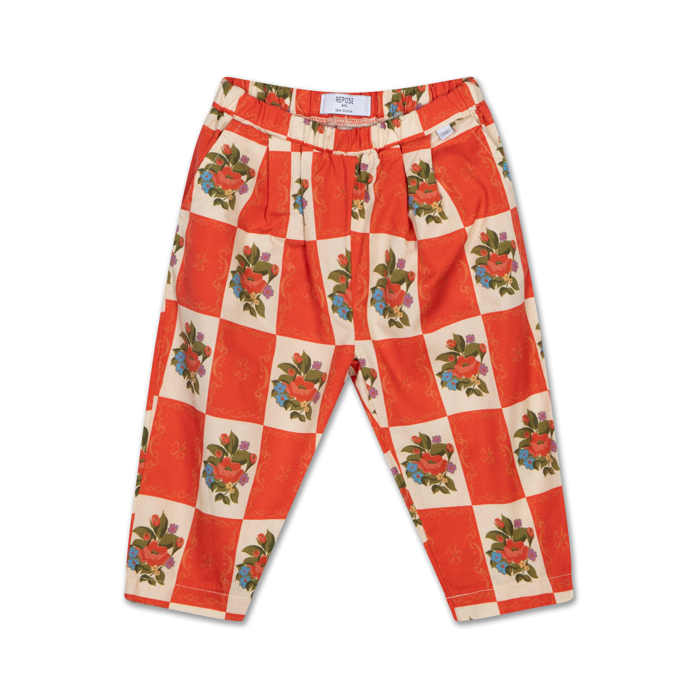 Lightweight organic cotton woven trousers in a flower tiles print, featuring an elasticated waistband and side pockets for comfort and practicality