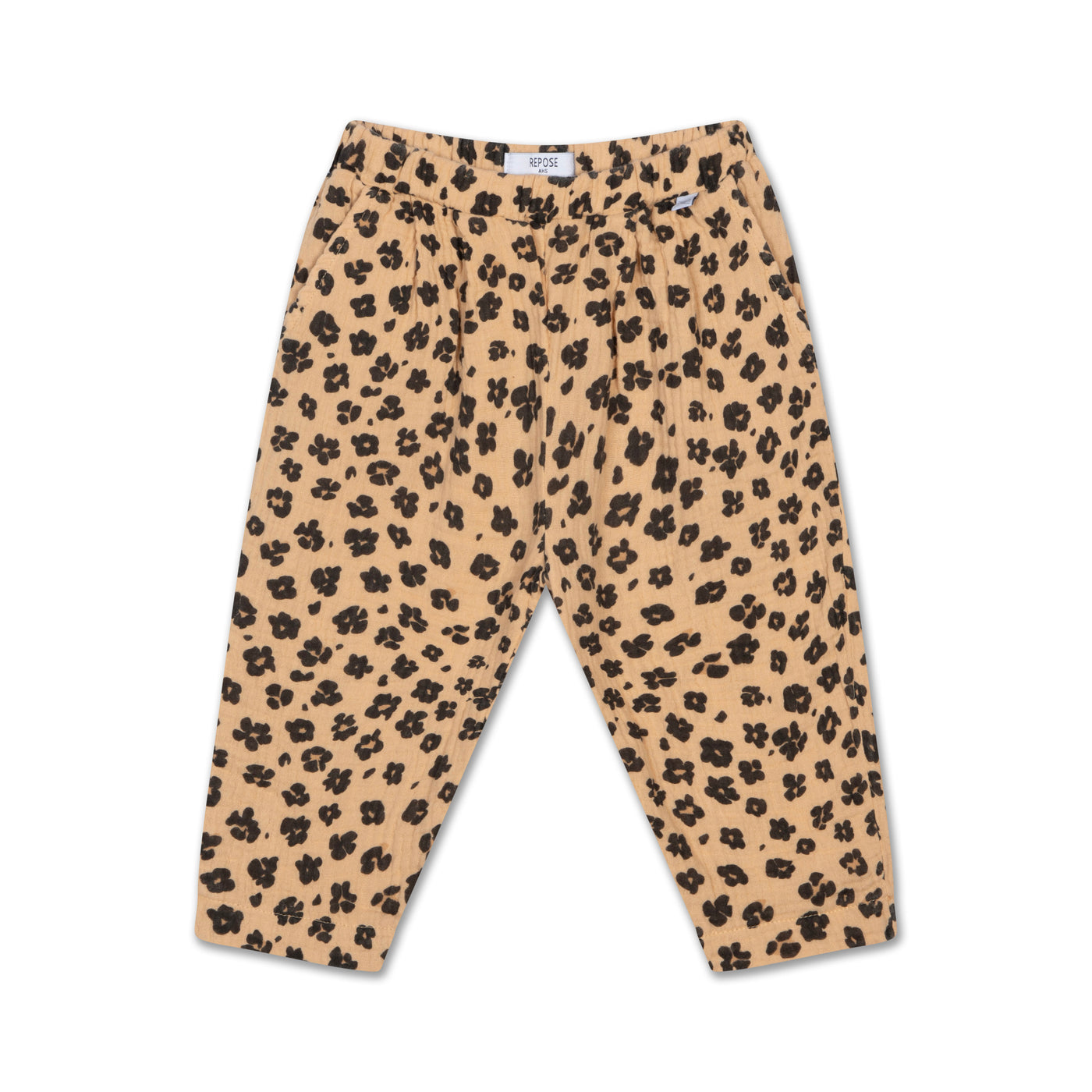 Lightweight organic cotton double gauze light woven trousers in a leopard flower all over print, featuring an elasticated waistband and side pockets for comfort and practicality.