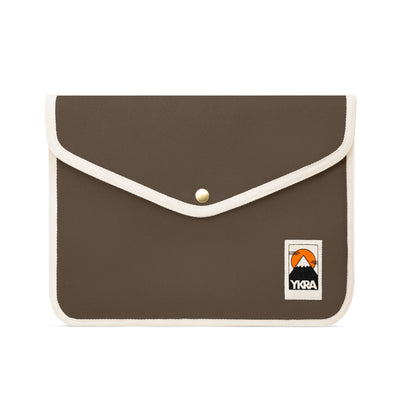 YKRA small khaki laptop sleeve, designed for travel and everyday use, available at Repose AMS.

