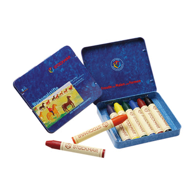 Metal box with 8 beeswax stick crayons including the color black.